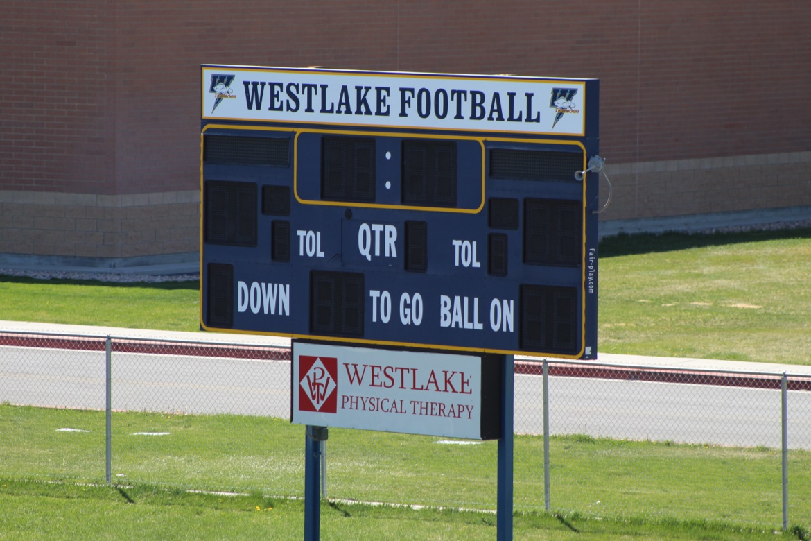 Westlake football scoreboard with a community sponsor panel